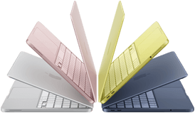 MacBook Neo laptops in silver, blush, citrus and indigo colours, slightly open and arranged in an arch formation