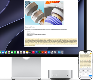 Mac mini front, tucked under Studio Display, an iPhone sits to the right of the device and the display, text selected with cut, copy, paste and AutoFill commands above on iPhone matches highlighted text on display, showcasing Universal Clipboard
