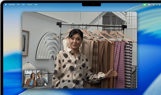 A video call on a MacBook Pro where a woman shows fabrics to two people on the call, with Centre Stage keeping her centred in the frame as she moves around