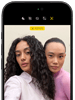 iPhone 18 Pro, black, front exterior, displaying two models posing for the camera, demonstrating the Center Stage front camera