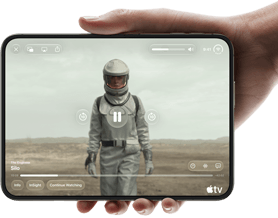 iPhone Duo, held with one hand, opened in horizontal orientation, fully unfolded, interior screen displays Apple TV show "Silo"