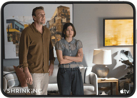 iPhone Duo, opened in horizontal position, Apple TV show "Shrinking" plays on screen