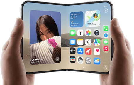 iPhone Duo, Star White colour, held by two hands in landscape orientation, unfolded, interior screen displays photos on the left, apps on the right